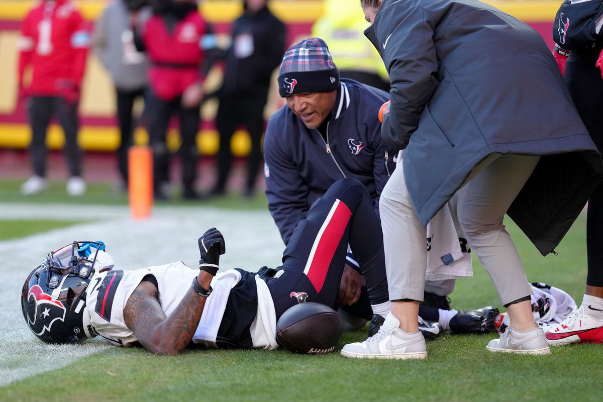 <i>Jason Hanna/Getty Images via CNN Newsource</i><br/>Medical staff look at Houston Texans wide receiver Tank Dell after he suffered multiple knee injuries while catching a touchdown in the third quarter of Saturday's game against the Kansas City Chiefs.