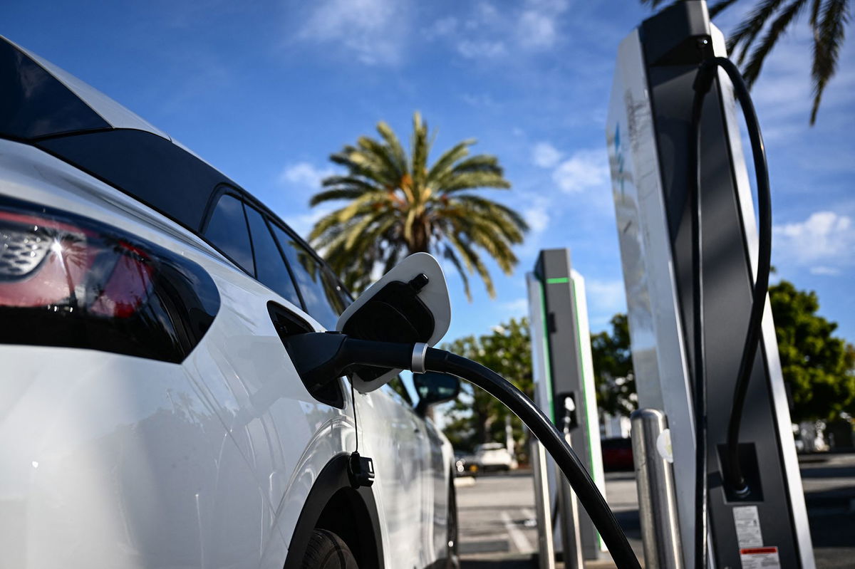 <i>Patrick T. Fallon/AFP/Getty Images via CNN Newsource</i><br/>A Volkswagen ID.4 electric vehicle (EV) charges in Torrance