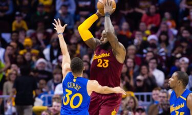 Kevin Durant shoots the ball in his first game as a Warrior against the defending champs.