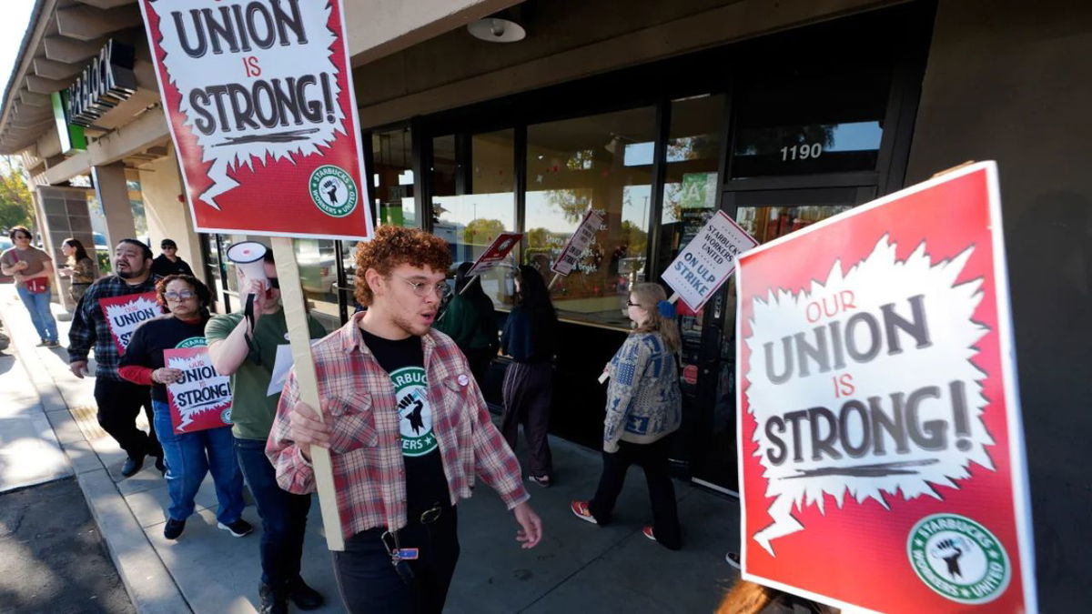 Starbuck workers picket outside of a closed Starbucks on Friday, Dec. 20, 2024, in Burbank, Calif. Damian Dovarganes/AP