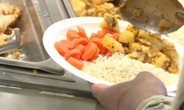 Potatoes, rice, and carrots on a plate.