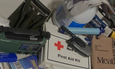 A photo of emergency supplies, like a first aid kit and radio.