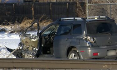 A damaged vehicle at the scene of the collision train, fatal, deadly