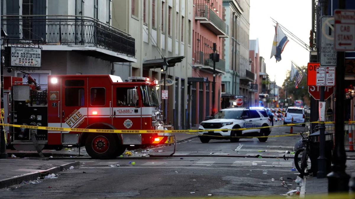 <i>Octavio Jones/Reuters via CNN Newsource</i><br />A fire truck and a police vehicle operate near the site where people were killed by a man driving a truck in an attack during New Year's celebrations