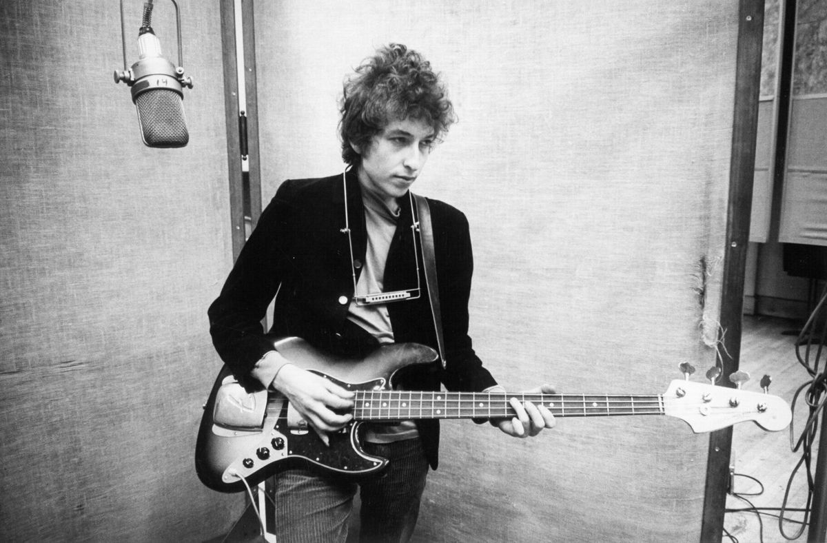 <i>Michael Ochs Archives/Getty Images via CNN Newsource</i><br/>Bob Dylan plays a Fender Jazz bass while recording his album 