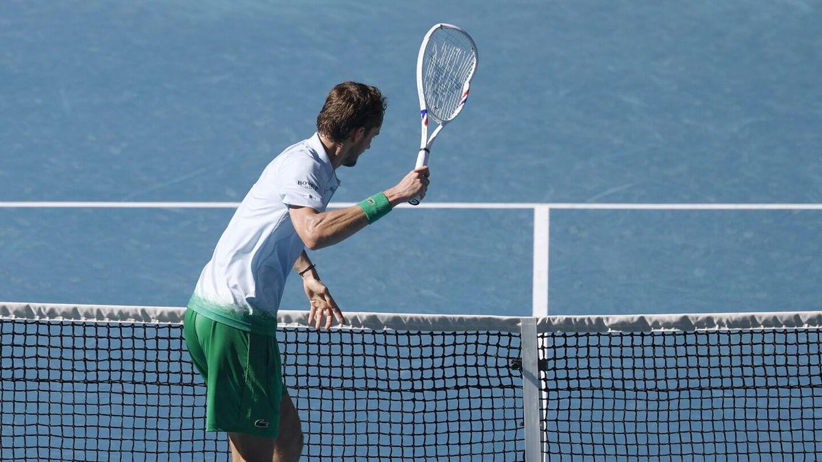 <i>Daniel Pockett/Getty Images via CNN Newsource</i><br/>Daniil Medvedev takes aim at a small camera attached to the net after growing frustrated.