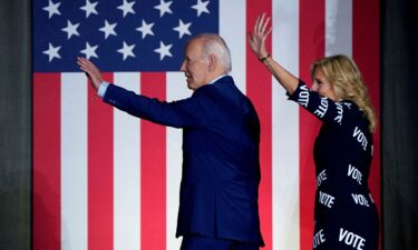 President Joe Biden and first lady Jill Biden wave during a campaign rally in Raleigh