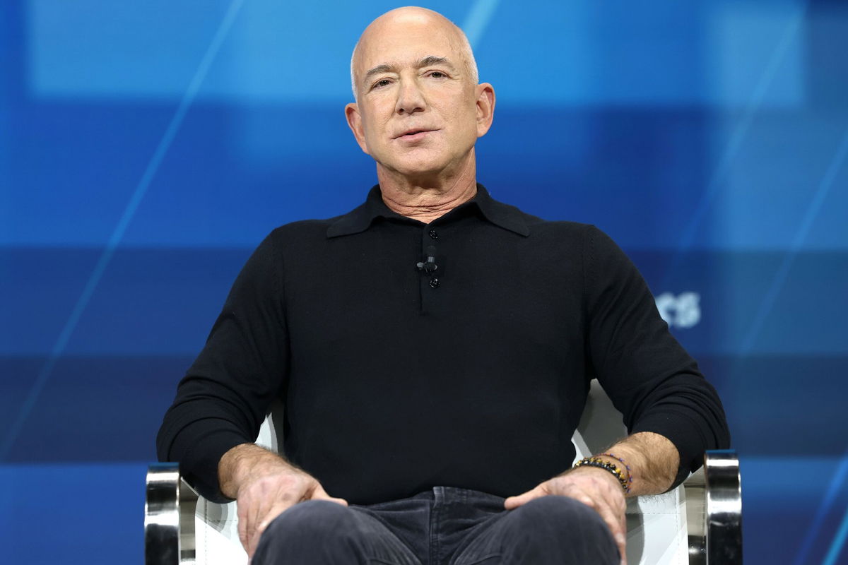 <i>Michael M. Santiago/Getty Images/File via CNN Newsource</i><br/>Jeff Bezos speaks during the New York Times annual DealBook summit on December 4