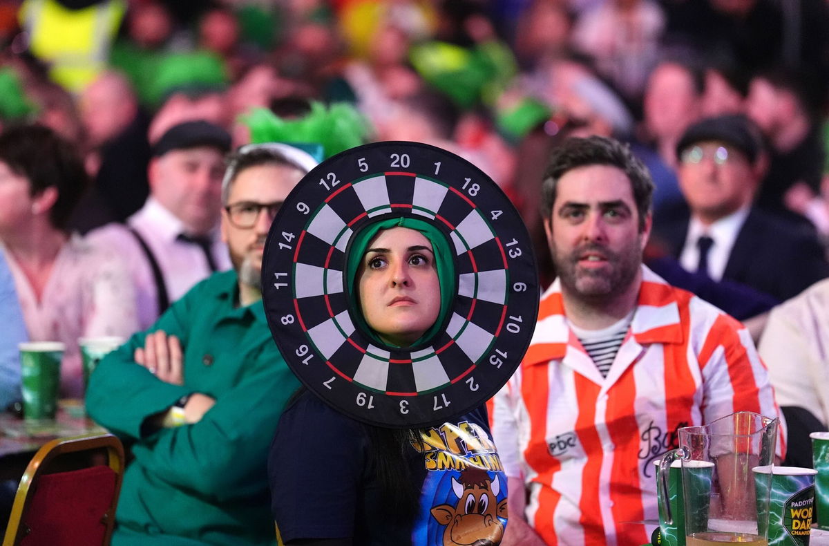 <i>Zac Goodwin/PA Images/Getty Images via CNN Newsource</i><br/>Darts fans create an almost pantomime atmosphere as the players compete.