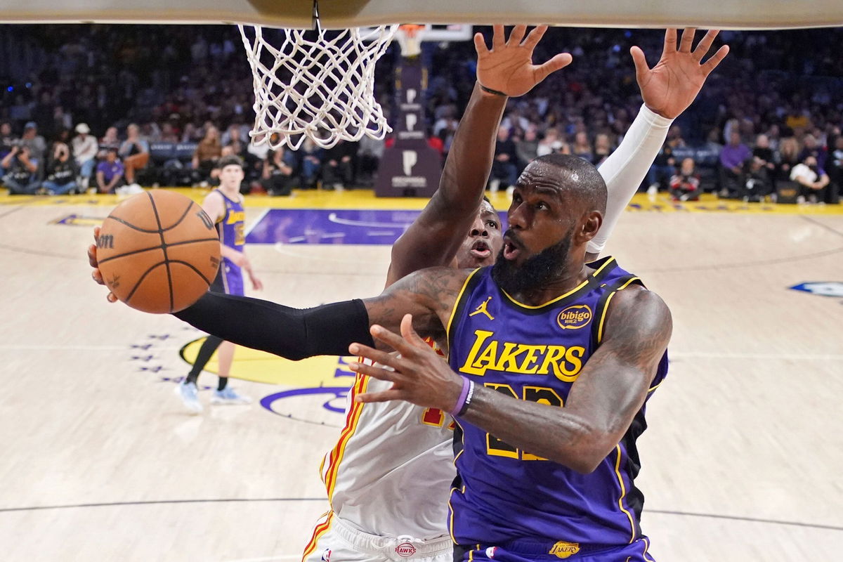 <i>Harry How/Getty Images via CNN Newsource</i><br />LeBron James scoring on a jumper over De'Andre Hunter and Bogdan Bogdanovic of the Atlanta Hawks. James set another record on Friday as he surpassed the legendary Michael Jordan’s mark for the most 30-point games in NBA history.