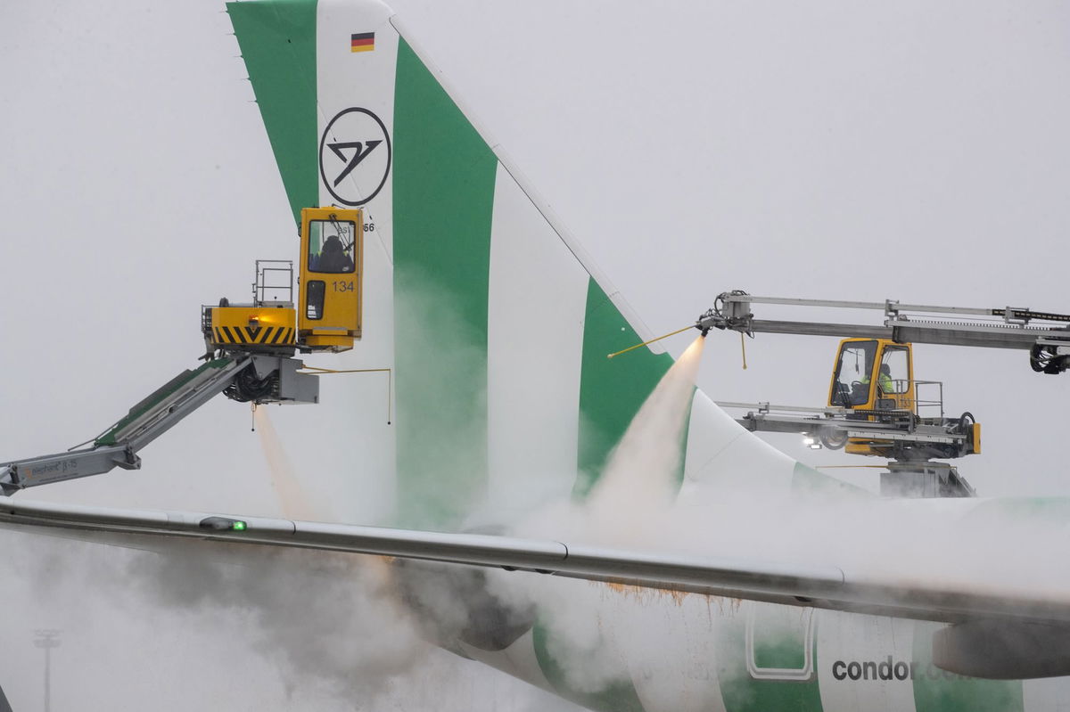 <i>Helmut Fricke/dpa/picture alliance/Getty Images via CNN Newsource</i><br/>An aircraft is de-iced at Frankfurt Airport on January 5. Heavy snowfall disrupted parts of Europe on Sunday