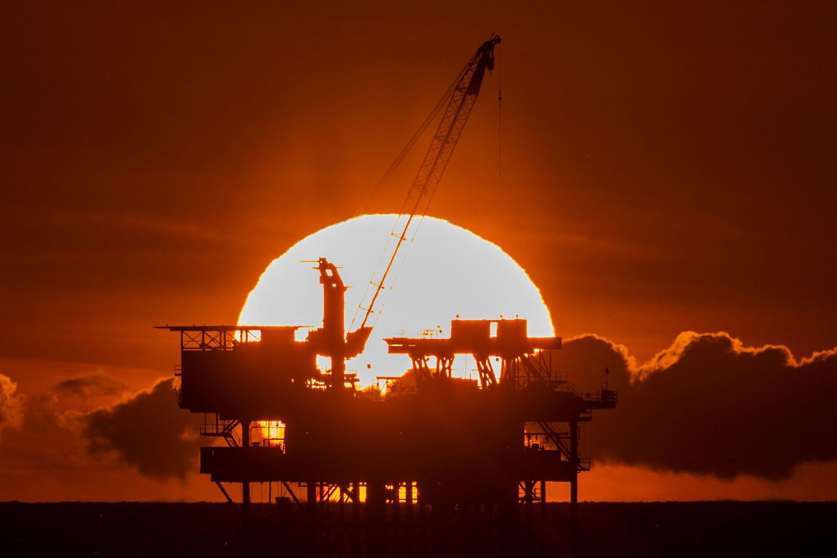 <i>David McNew/Getty Images via CNN Newsource</i><br />An offshore oil platform is seen at sunset near Huntington Beach