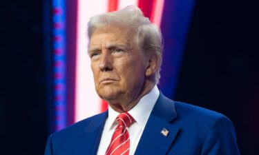 President-elect Donald Trump looks on during Turning Point USA's AmericaFest at the Phoenix Convention Center on December 22 in Phoenix