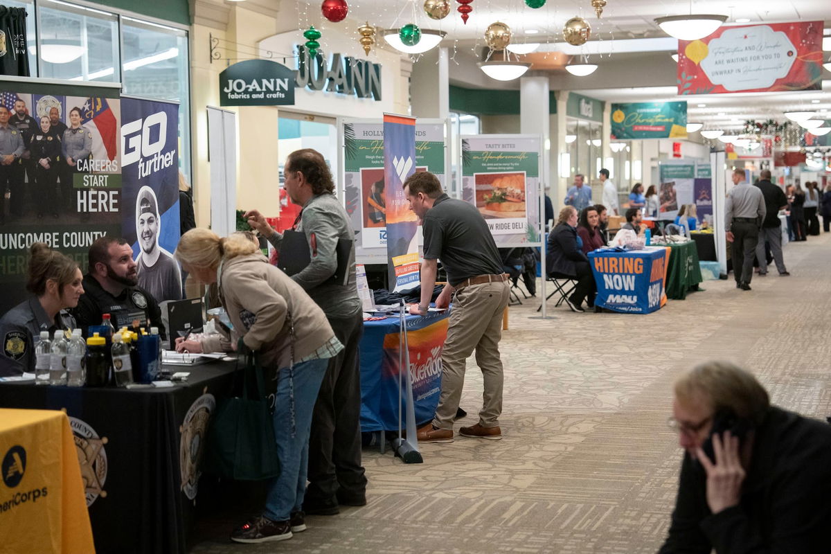 <i>Allison Joyce/Bloomberg/Getty Images via CNN Newsource</i><br/>Hiring representatives speak with jobseekers at a job and resource fair hosted by the Mountain Area Workforce Development Board in partnership with NCWorks in Hendersonville