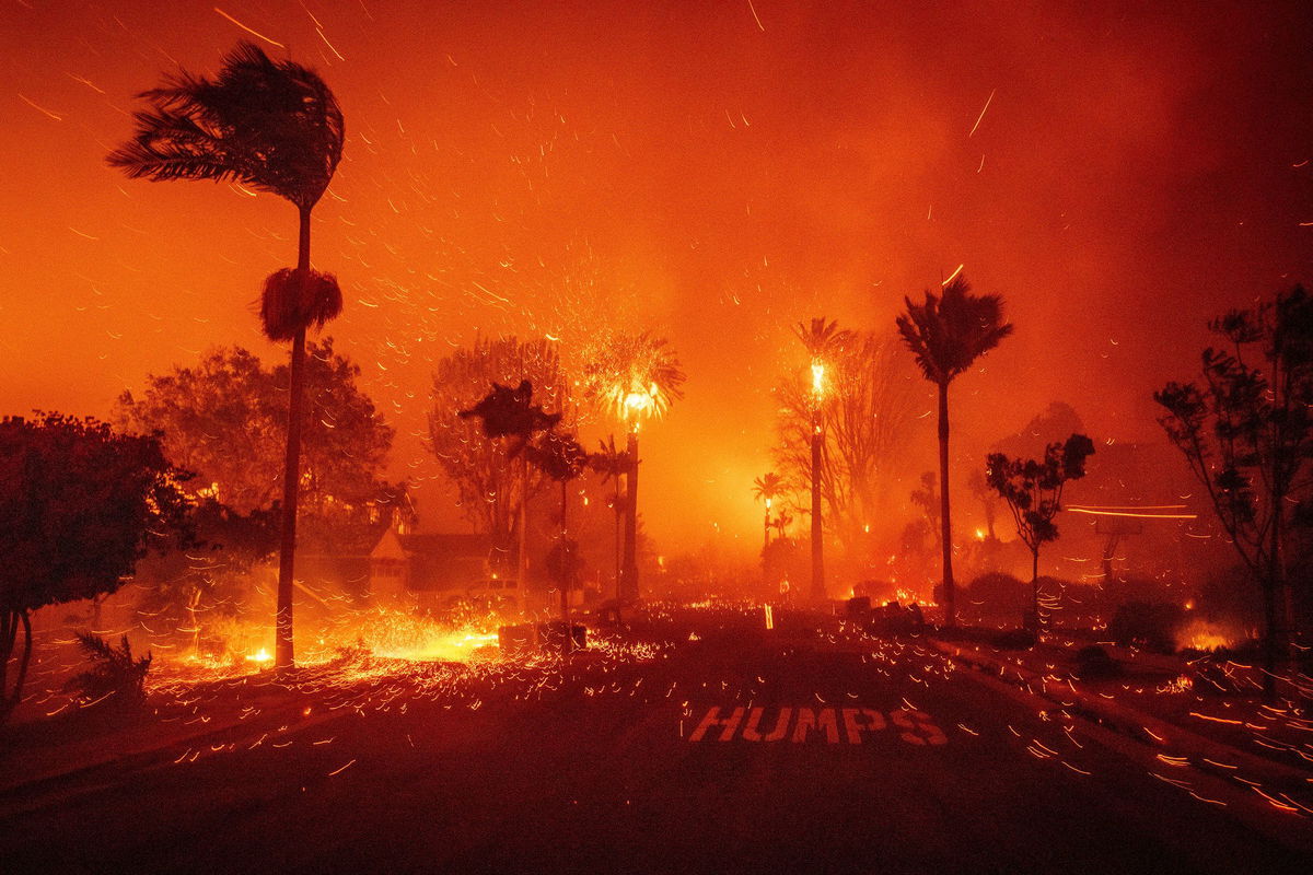 <i>Daniel Cole/Reuters via CNN Newsource</i><br/>A staircase remains standing amid the ruins of a burnt structure along the Pacific Coast Highway in Malibu