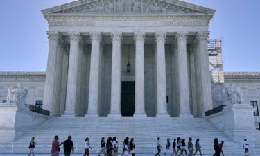 Tourists gather outside the U.S. Supreme Court on June 07