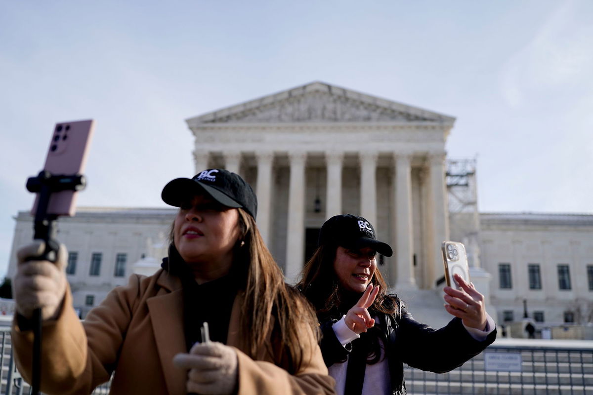 <i>Kent Nishimura/Bloomberg/Getty Images via CNN Newsource</i><br/>Content creators livestream outside the US Supreme Court in Washington