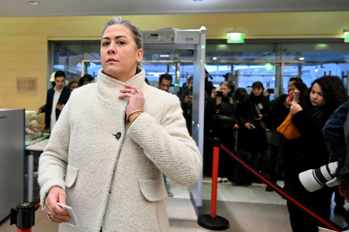 <i>Miguel Medina/AFP/Getty Images/File via CNN Newsource</i><br />Caroline Darian passes through security check as she arrives at the courthouse in Avignon