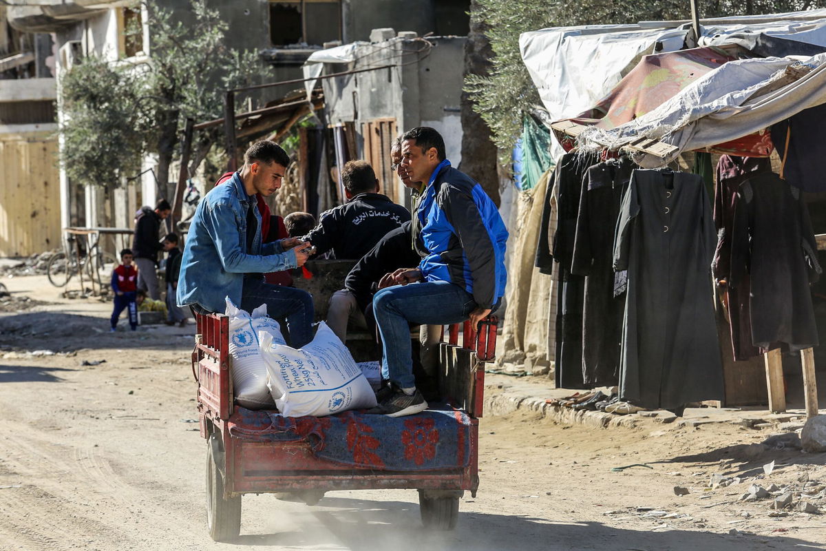 <i>Abed Rahim Khatib/Anadolu/Getty Images via CNN Newsource</i><br/>Flour is distributed in Khan Yunis by the UN agency for Palestinian refugees