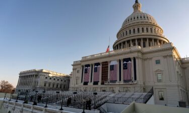 Flags on the US Capitol during a rehearsal ahead of the 60th presidential inauguration in Washington