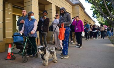 People arrive with their pets at an evacuation center in the Pasadena Convention Center as they flee wildfires in the Los Angeles area on January 10.