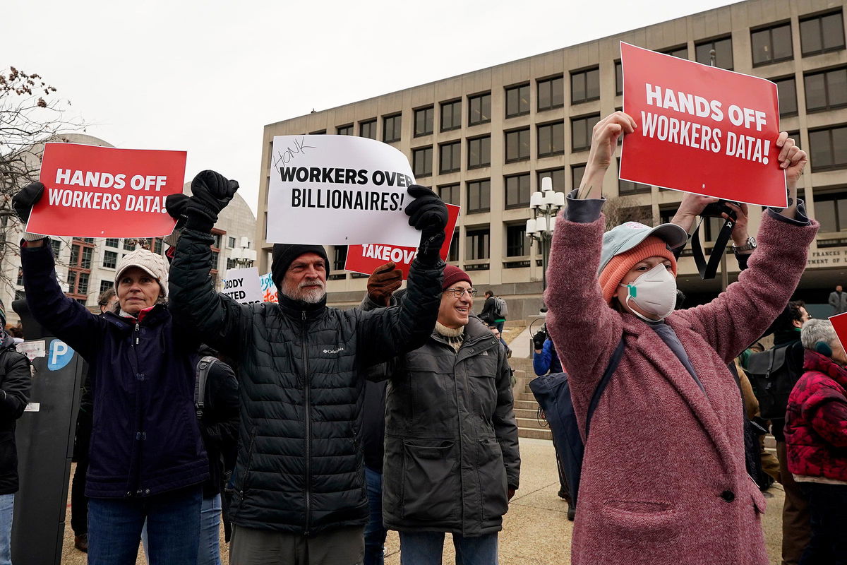 <i>Al Drago/Getty Images via CNN Newsource</i><br/>Workers and supporters protest against the Department of Government Efficiency (DOGE) in front of the US Department of Labor on February 5