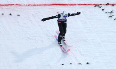 Forfang competes in the ski jumping team large hill event at the Nordic world championships