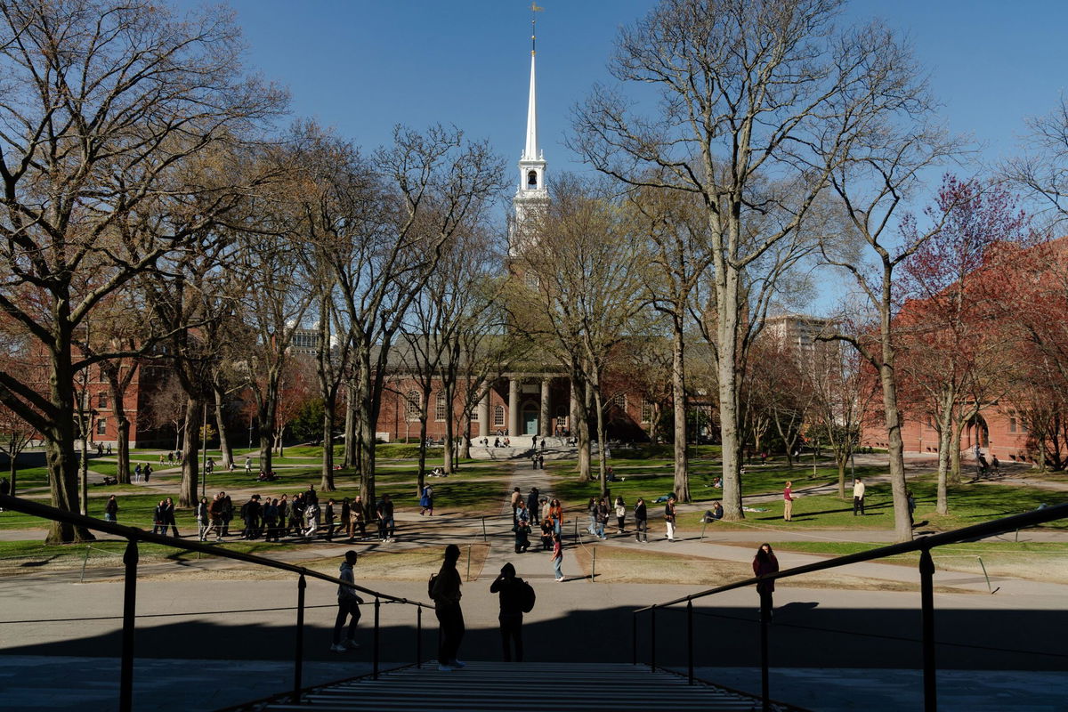 <i>Sophie Park/Getty Images via CNN Newsource</i><br/>People cross the Harvard University campus on April 17 in Cambridge