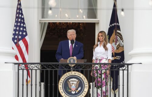 President Donald Trump speaks as first lady Melania Trump listens during the congressional picnic on the South Lawn of the White House on June 12 in Washington.