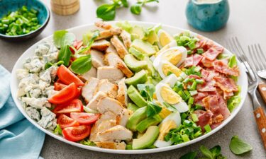 Greek salad is known as "village salad" in Greece. It includes tomatoes and a wedge of feta.