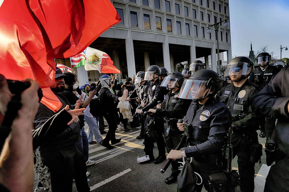 <i>Eric Thayer/AP via CNN Newsource</i><br />California National Guard are positioned at the federal building on June 10 in downtown Los Angeles.