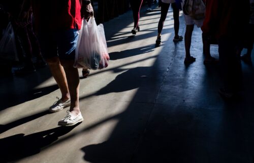 A shopper carries a bag at a market in Detroit