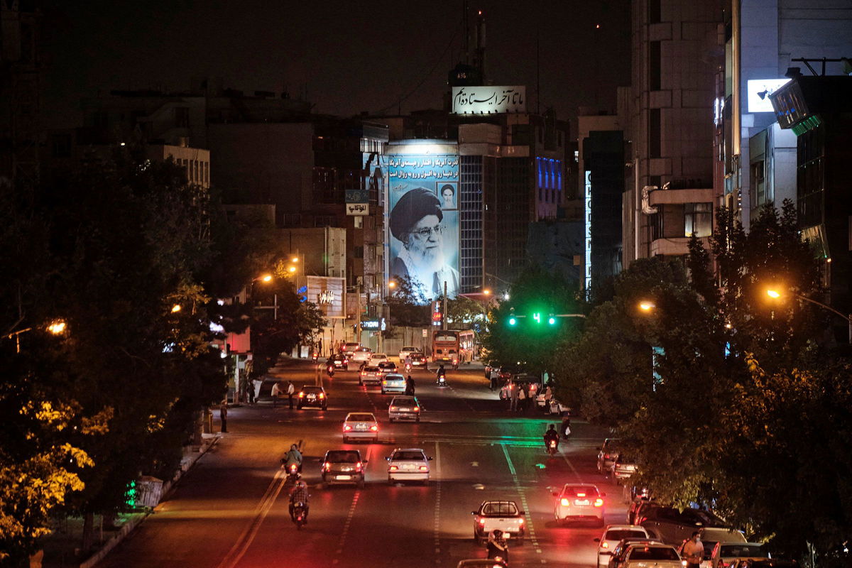 <i>Morteza Nikoubazl/AFP/Getty Images via CNN Newsource</i><br/>A banner depicting Irans Supreme Leader Ayatollah Ali Khamenei is illuminated in downtown Tehran in June 2021.