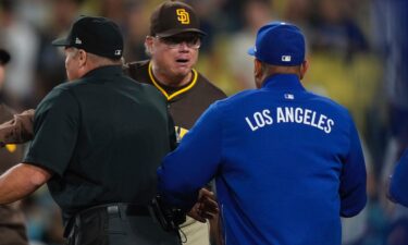 Dodgers superstar Shohei Ohtani waves off teammates after getting hit by a pitch in the ninth inning on June 19.