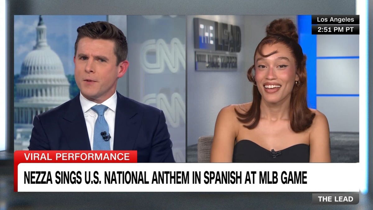 <i>Kevork Djansezian/Getty Images via CNN Newsource</i><br/>Nezza sings the national anthem in Spanish before a baseball game between the Los Angeles Dodgers and San Francisco Giants at Dodger Stadium on June 14 in Los Angeles.