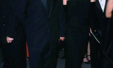 A tortoise shell headband and kick-flare jeans are among the key elements of Bessette-Kennedy's signature look.