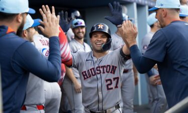Jose Altuve celebrates in the dugout after his two-run home run in the third inning.