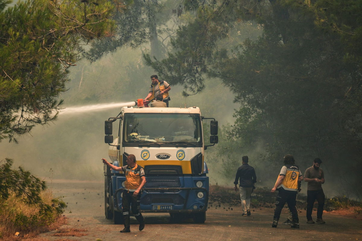 <i>Ghaith Alsayed/AP via CNN Newsource</i><br/>Smoke rises into the sky during a wildfire in the town of Rabia