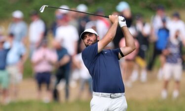 Scottie Scheffler hits his second shot on the 12th hole of The Open Championship on Sunday in Portrush