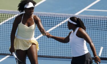 Williams celebrates with Hailey Baptiste after a point in their doubles match at the Mubadala Citi DC Open on July 21.