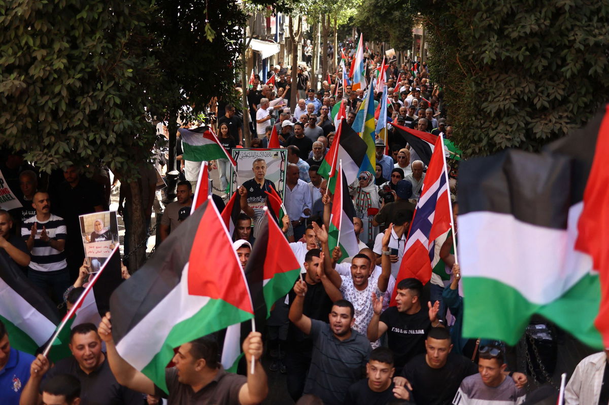 <i>Zain Jaafar/AFP/Getty Images via CNN Newsource</i><br/>Palestinians chant slogans during a gathering in Ramallah on September 23