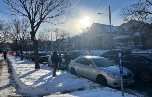 A man walks through the Cedar-Riverside neighborhood